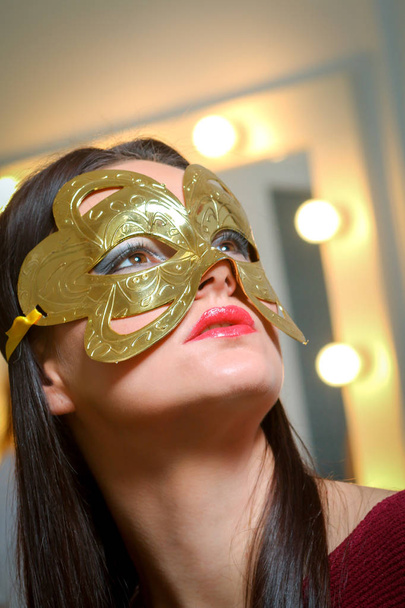 Beauty model woman wearing masquerade carnival mask over Christm - Photo, Image