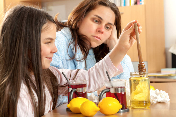 Mother and daughter with cold or flu - Photo, Image