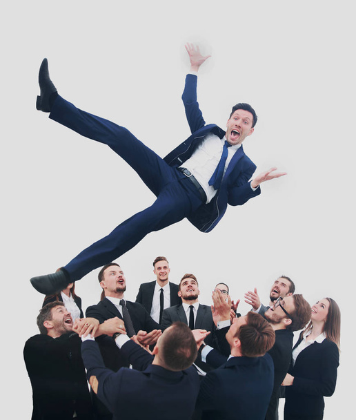 Business team throwing his colleague - 写真・画像