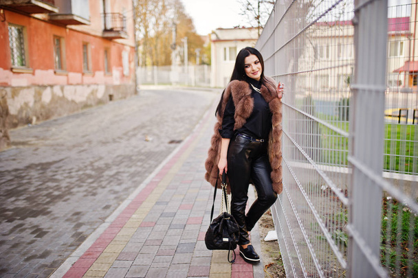 Fashion outdoor photo of gorgeous sensual woman with dark hair i - Foto, Bild