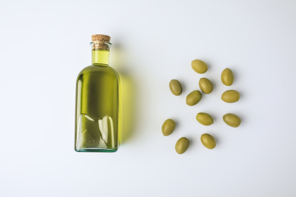 glass bottle with olive oil  - Фото, зображення