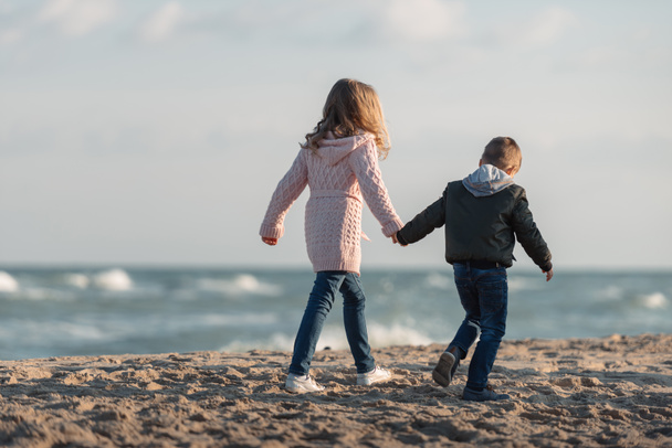 brother and sister holding hands  - Photo, Image
