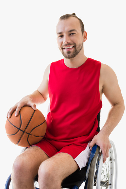sportsman in wheelchair with basketball ball - Фото, изображение