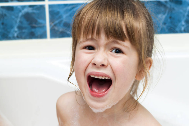 Portrait of pretty little girl in bath. Hygiene concept. - Photo, Image