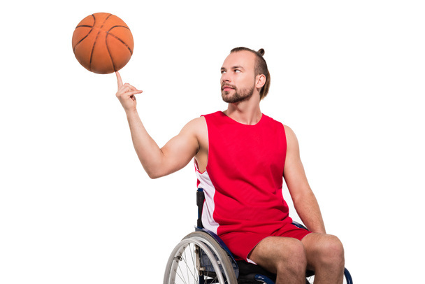 sportsman in wheelchair playing with basketball  - Fotoğraf, Görsel