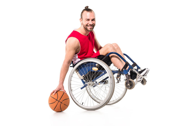 sportsman in wheelchair playing basketball - Valokuva, kuva