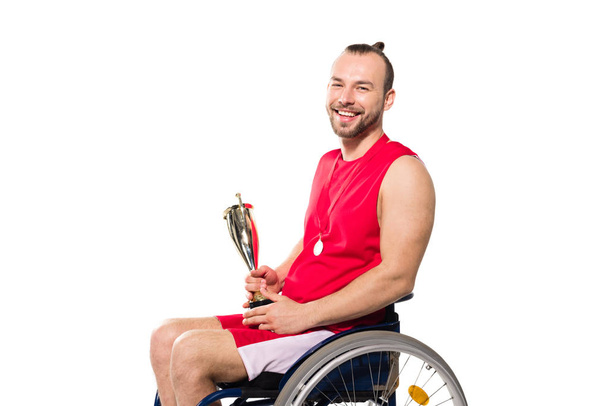 sportsman in wheelchair holding trophy  - Photo, Image
