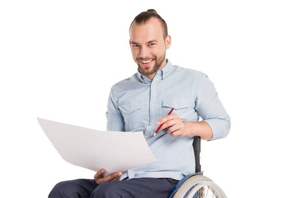 disabled man working with papers - Foto, Bild
