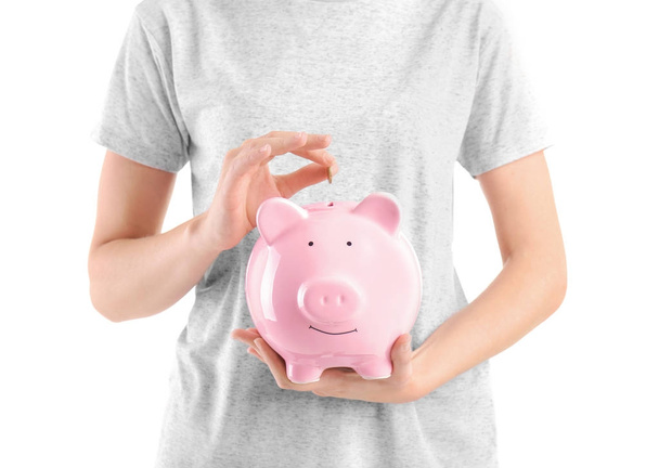 Young woman with piggy bank - Photo, image