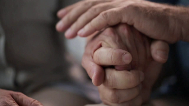senior couple holding hands - Video