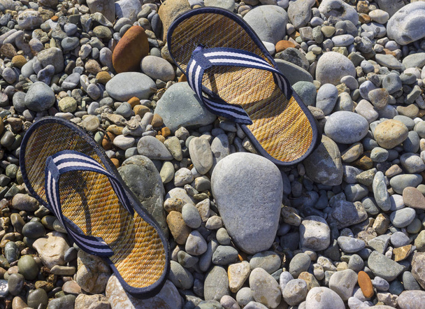 blue shales lie on the pebbles under the sun. Time relax - Foto, Imagem