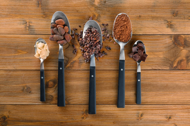 Spoons with different cocoa products  - Foto, afbeelding