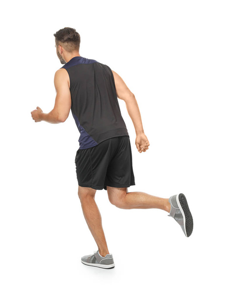 Young man in sportswear running   - Фото, изображение