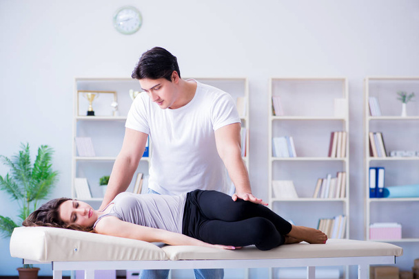 Young doctor chiropractor massaging female patient woman - Zdjęcie, obraz