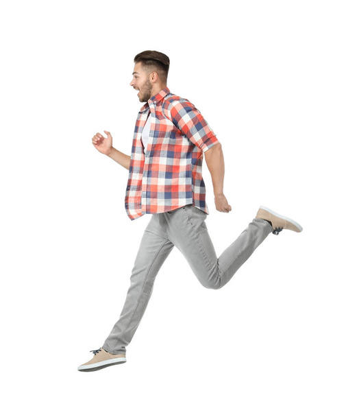 Young man in casual clothes running   - Foto, afbeelding