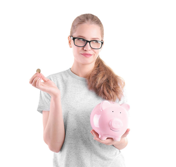 young woman with piggy bank - 写真・画像