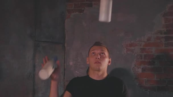 Bartender juggling bottles and shaking cocktail at a mobile bar - Felvétel, videó