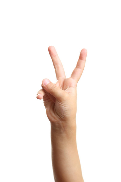 Child hand with v sign on white background - Foto, afbeelding