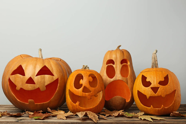 Halloween pumpkins with dry leaves  - Foto, Bild