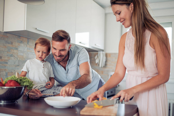 Happy family cooking together - Photo, Image