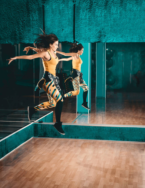 Zumba dance jumping female - Foto, imagen