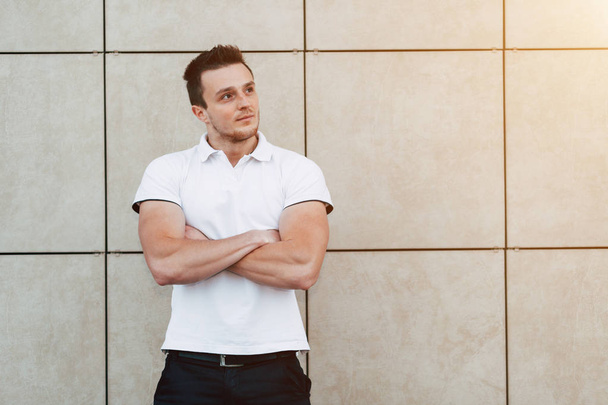 Muscular Man Standing Near the Wall - Photo, Image