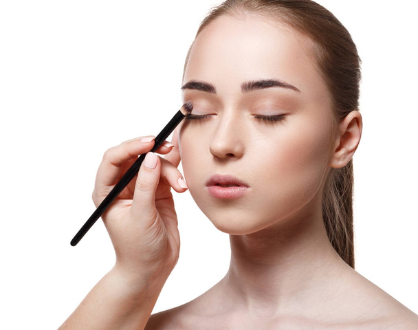 Applying female makeup, isolated on white - Foto, Imagen