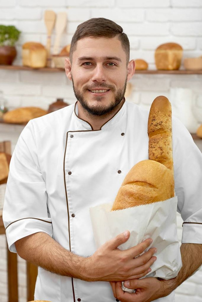 Young man working at his bakery - Fotografie, Obrázek