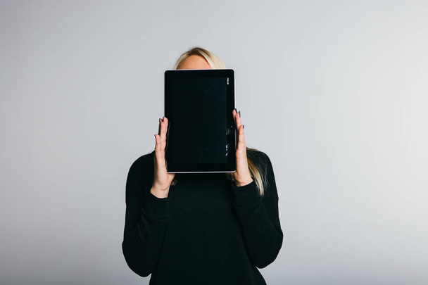 woman covering face with tablet computer - Photo, Image