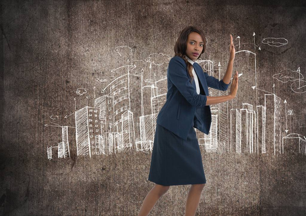 Businesswoman pushing hands with city drawings - Φωτογραφία, εικόνα