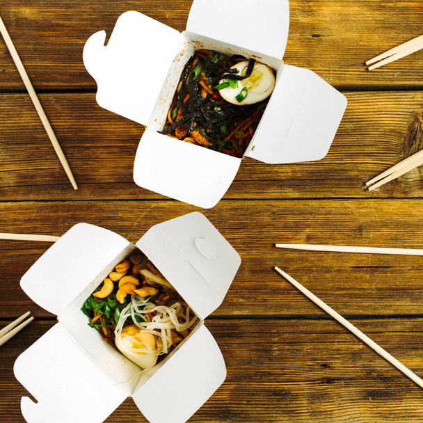 Noodles in boxes and chopsticks - Photo, Image
