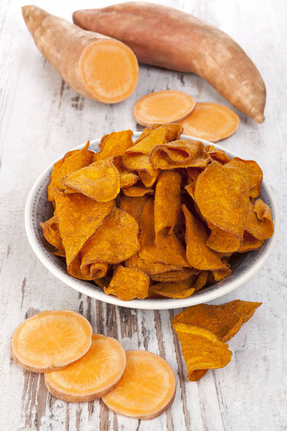 Fried and raw red batata chips  - Photo, Image
