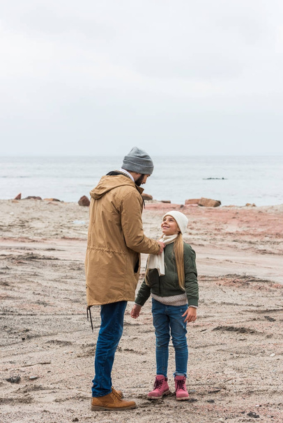 father and daughter on seashore - Photo, image
