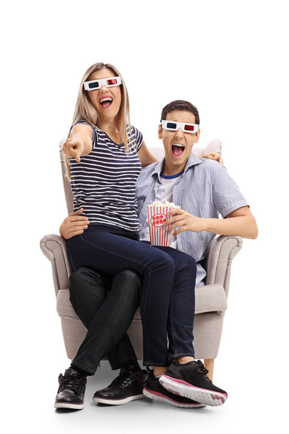 couple with 3D glasses and popcorn laughing - Photo, image