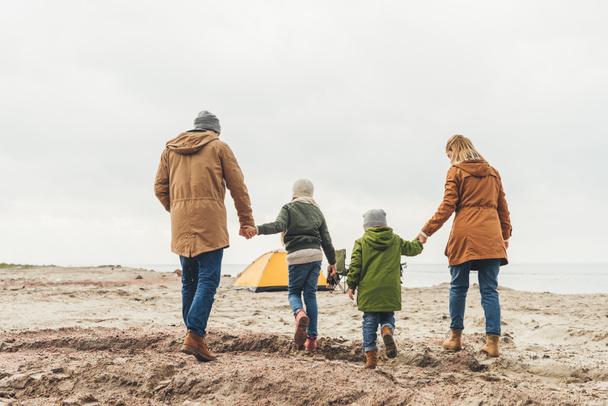 family walking to camping tent - Photo, image