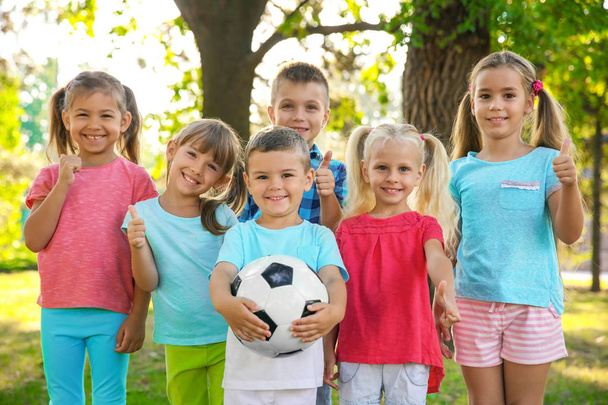 Cute little children with ball in park - Zdjęcie, obraz