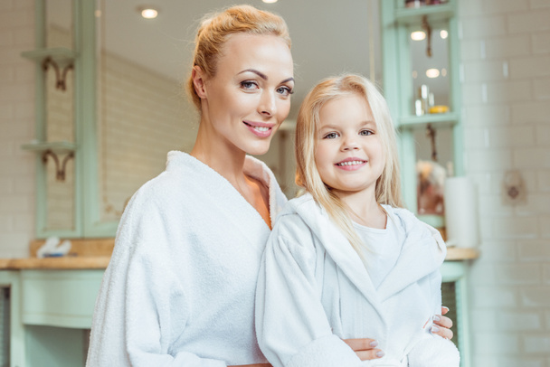 mother and daughter in bathrobes - Photo, Image