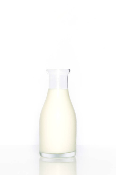 Bottle of milk on white background  - Фото, изображение