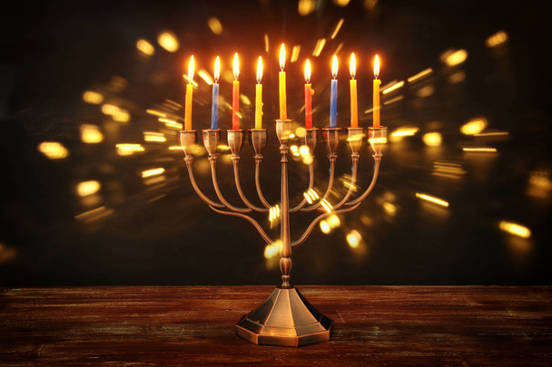 image of jewish holiday Hanukkah background with menorah (traditional candelabra) and burning candles - Foto, Imagen