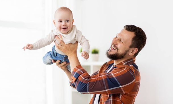 happy father with little baby boy at home - Zdjęcie, obraz