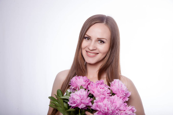 Beautiful girl with peony flowers - Fotografie, Obrázek