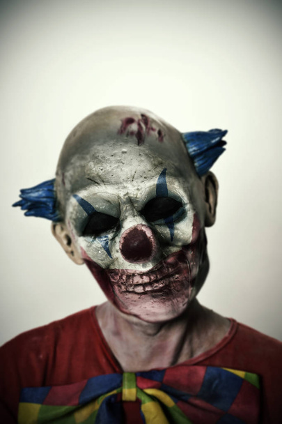 double exposure of a scary clown and a skull - Photo, Image