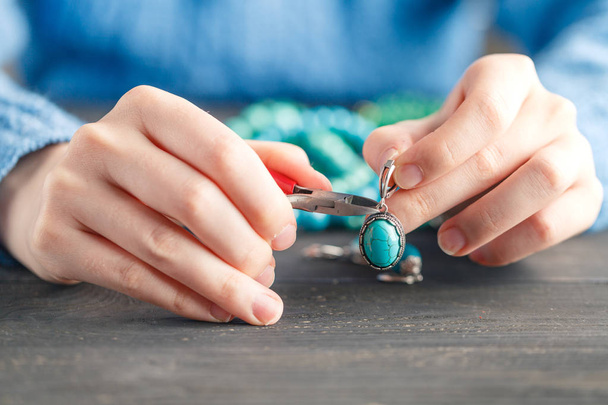 Handmade earrings making, home workshop. Woman artisan create tassel jewelry. Art, hobby, handicraft concept - Valokuva, kuva