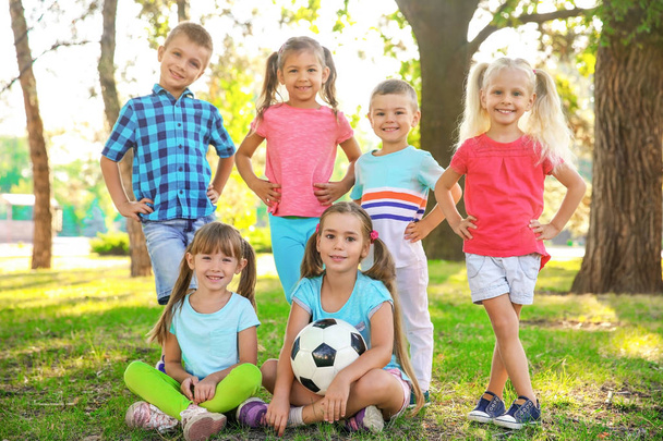 Cute little children with ball in park - Φωτογραφία, εικόνα