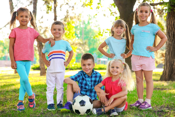 Cute little children with ball in park - Φωτογραφία, εικόνα