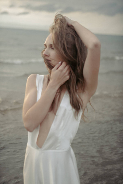  girl in white dress in the sea - Zdjęcie, obraz