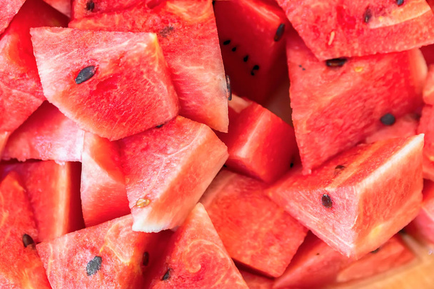 Sliced red ripe watermelon. Fruit background and texture - Fotó, kép