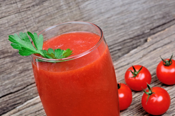Glass of fresh tomato juice on rustic wooden background - Photo, Image