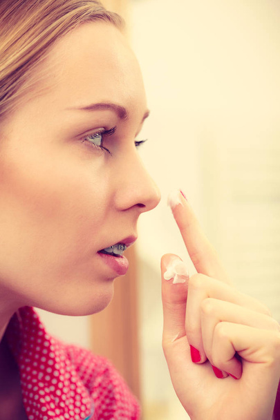 Woman applying moisturizing skin cream. Skincare. - Fotoğraf, Görsel