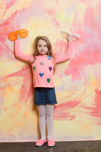 Child girl on colorful background. - 写真・画像
